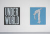 The image shows two paintings hung on a white wall next to each other. They are square. The painting to the left has a black background and pale grey text in block capital lettters reads on one line 'Under' and on the second line 'World'. The painting to the right has a sky blue background and shows a pale skinned naked person leaning over. 