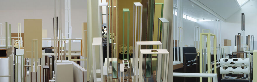 Images from Nahum Tevet/Ergin Çavuşoğlu's exhibition show a large structure made out of frames of plywood, which are painted different colours.